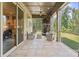 Covered porch with stone fireplace, outdoor seating and sliding glass doors for seamless indoor-outdoor living at 426 Kirkbride Ct, Fort Mill, SC 29715
