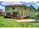 Spacious backyard featuring a wooden deck, bay window and a stone patio with seating at 4312 Beech Wood Ct # 140, Belmont, NC 28012