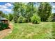 Lush backyard with mature trees, offering ample space and natural beauty at 4312 Beech Wood Ct, Belmont, NC 28012