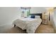 Bright bedroom featuring a comfortable bed with patterned bedding and natural light from two windows at 4312 Beech Wood Ct, Belmont, NC 28012