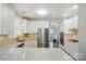Bright kitchen featuring stainless steel appliances, white cabinetry, and granite countertops at 4312 Beech Wood Ct, Belmont, NC 28012