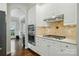 Modern kitchen featuring white cabinetry, granite countertops, and stainless steel appliances at 4312 Beech Wood Ct, Belmont, NC 28012