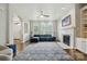 Bright living room featuring hardwood floors, fireplace, built-in shelving and many windows at 4312 Beech Wood Ct, Belmont, NC 28012