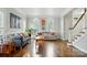 Spacious living room with hardwood floors, arched windows, and ample seating at 4312 Beech Wood Ct, Belmont, NC 28012