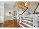 Bright, spacious staircase with carpeted steps and a wooden railing at 4312 Beech Wood Ct, Belmont, NC 28012