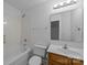 Bathroom with soaking tub, vanity with white sink, and large mirror at 435 Hurston Cir, Charlotte, NC 28208
