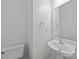 Bright half bathroom with white fixtures and modern faucet and mirror at 435 Hurston Cir, Charlotte, NC 28208