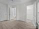 Bedroom featuring neutral carpet with adjoining bathroom and walk-in closet at 435 Hurston Cir, Charlotte, NC 28208