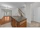 Granite island with double sink, stainless steel appliances, and open layout to living area at 435 Hurston Cir, Charlotte, NC 28208