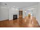 Bright living room featuring hardwood floors, fireplace, and open layout at 435 Hurston Cir, Charlotte, NC 28208