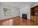 Bright living room with a fireplace and plenty of natural light at 435 Hurston Cir, Charlotte, NC 28208