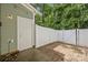 Private patio area with brick pavers, enclosed by a white fence and perfect for outdoor relaxation at 435 Hurston Cir, Charlotte, NC 28208