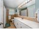 Well-lit bathroom with tiled walls, ample counter space, and a large mirror, offering functionality and style at 4720 Randleman Rd, Conover, NC 28613