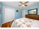 Comfortable bedroom with hardwood floors, ceiling fan, and plenty of closet space, designed for relaxation at 4720 Randleman Rd, Conover, NC 28613