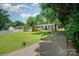 Inviting single-story home with well-maintained lawn, driveway, and charming landscaping enhancing its appeal at 4720 Randleman Rd, Conover, NC 28613