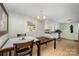 Charming kitchen and dining area featuring tile floors and natural light, great for casual dining and entertaining at 4720 Randleman Rd, Conover, NC 28613