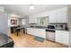 Well-lit kitchen featuring stainless steel appliances, tile floors, and ample counter space for meal preparation at 4720 Randleman Rd, Conover, NC 28613