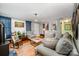 Inviting living room with hardwood floors, wood-burning stove, and comfortable seating; perfect for relaxation at 4720 Randleman Rd, Conover, NC 28613