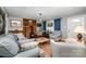 Inviting living room with hardwood floors, wood-burning stove, and comfortable seating; perfect for relaxation at 4720 Randleman Rd, Conover, NC 28613