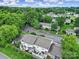 Aerial view of property surrounded by mature trees and landscaping in a community at 502 Heritage Pkwy, Fort Mill, SC 29715