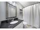 Bathroom featuring a framed mirror, granite countertops, and a shower with a curtain at 502 Heritage Pkwy, Fort Mill, SC 29715