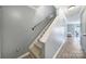 Hallway with carpeted stairs and wood laminate flooring leading to the living area at 502 Heritage Pkwy, Fort Mill, SC 29715