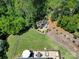 Aerial view of backyard showing deck, firepit, landscaping, and trees at 510 Placid Ct, Tega Cay, SC 29708