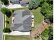Aerial view of home showcasing manicured lawn, deck, and stone firepit area at 510 Placid Ct, Tega Cay, SC 29708