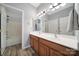 Bathroom with a double sink vanity, large mirror and full tub and shower combination at 510 Placid Ct, Tega Cay, SC 29708