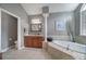 The bathroom features a soaking tub, tile floors, granite countertops, and neutral paint at 510 Placid Ct, Tega Cay, SC 29708