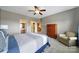 Bedroom featuring carpet, neutral walls, full dresser, and ensuite bath and closet at 510 Placid Ct, Tega Cay, SC 29708