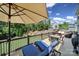 Outdoor deck with lounge chairs, dining table, and sun umbrella at 510 Placid Ct, Tega Cay, SC 29708