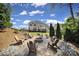 Cozy fire pit area with seating and lush surroundings at 510 Placid Ct, Tega Cay, SC 29708