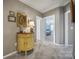 Hallway featuring a painted wooden cabinet with views into the front bedroom at 510 Placid Ct, Tega Cay, SC 29708