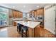 Modern kitchen boasts stainless steel appliances, a marble backsplash, and a large center island at 510 Placid Ct, Tega Cay, SC 29708