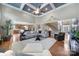 Open-concept living room with hardwood floors, tall ceilings, and neutral paint at 510 Placid Ct, Tega Cay, SC 29708