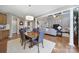 Spacious living room and dining area with hardwood floors, gray walls, and natural light at 510 Placid Ct, Tega Cay, SC 29708