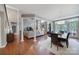 Open concept living room and dining area with large windows and hardwood floors at 510 Placid Ct, Tega Cay, SC 29708