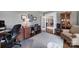 Bright office with french doors, hardwood floors, built-in desk, and comfortable seating, perfect for working from home at 510 Placid Ct, Tega Cay, SC 29708