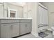 Elegant bathroom with double vanity, modern fixtures, and a shower-tub combination with curtain at 5129 Whitman Ave, Matthews, NC 28105