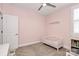 Cozy Bedroom featuring white toddler bed, plantation shutters, and neutral decor for a calming space at 5129 Whitman Ave, Matthews, NC 28105