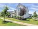 Charming white home with a neatly landscaped front yard and a welcoming pathway at 5129 Whitman Ave, Matthews, NC 28105