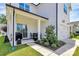 Well-maintained home exterior with a patio, lush lawn, and two-car garage at 5129 Whitman Ave, Matthews, NC 28105