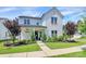 Inviting white brick home with a covered front porch and beautiful landscaping at 5129 Whitman Ave, Matthews, NC 28105