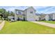 Beautiful home exterior with a spacious lawn, modern design, and an attached garage at 5129 Whitman Ave, Matthews, NC 28105