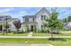 Attractive white home with manicured lawn and landscaping, showcasing its curb appeal at 5129 Whitman Ave, Matthews, NC 28105