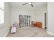 Spacious playroom featuring built-in shelving, natural light, and plenty of space to play at 5129 Whitman Ave, Matthews, NC 28105