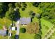 Top down aerial view of property featuring mature trees, manicured lawn, outbuildings, and trampoline at 5425 Creek Run Ct, Kings Mountain, NC 28086