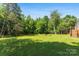 Expansive backyard features mature trees, a fire pit, and an outbuilding at 5425 Creek Run Ct, Kings Mountain, NC 28086