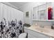 Cozy bathroom features a shower with floral curtain and a light vanity sink at 5425 Creek Run Ct, Kings Mountain, NC 28086